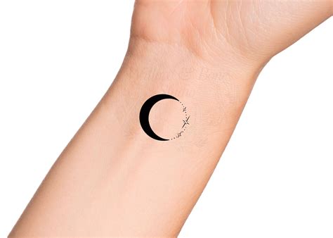 small crescent moon tattoo